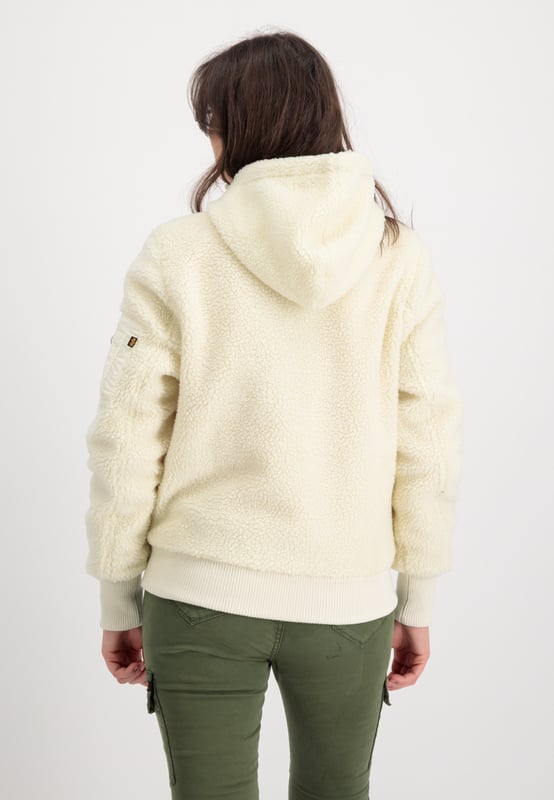 This is the Zip Hood Teddy winter jacket for women from Alpha Industries. The spacious front pockets provide plenty of room for you and your everyday essentials. The jacket made of teddy material features a regular fit and large nylon pockets.
