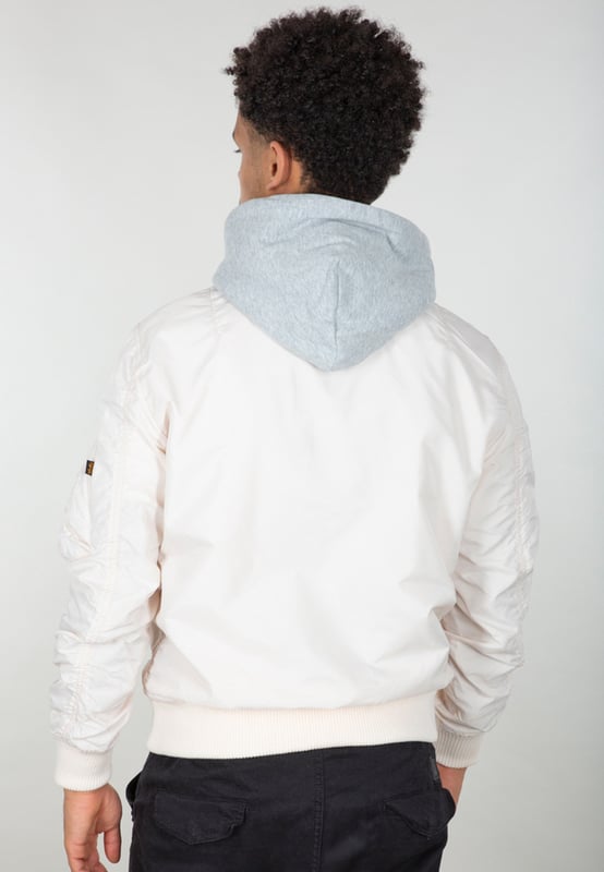MA-1 TT Two Tone Hood Bomber Jacket The MA-1 TT Two Tone Hood Bomber Jacket combines style and functionality in a lightweight jacket. TT Nylon ensures comfort, while the slim-fit design offers a modern silhouette. The detachable hood, made of cotton and polyester, provides versatile styling options. Two exterior pockets, two interior pockets, and a utility pocket with an RBF Tag offer storage space. Ribbed cuffs and stylish accents such as the leather tab and the Alpha Logo Velcro Patch make it a versatile must-have.