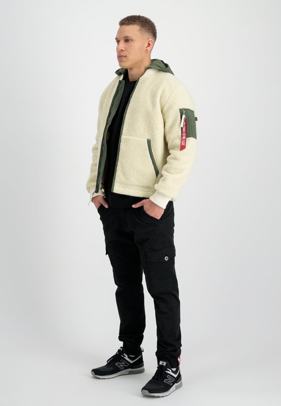 Teddy Nylon Zip Hood Bomber Jacket The Teddy Nylon ZH Jacket by ALPHA INDUSTRIES is a bomber jacket for men with a regular fit. The jacket is lightly lined and has side pockets and a zip fastening. With its stylish design, it is the perfect companion for everyday wear.