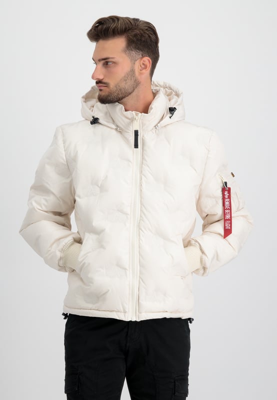 This is the Hooded Logo Puffer winter jacket from Alpha Industries. The quilted design and embossed logo give this jacket a stylish look, while the detachable and adjustable hood provides extra warmth and protection against wind and water.