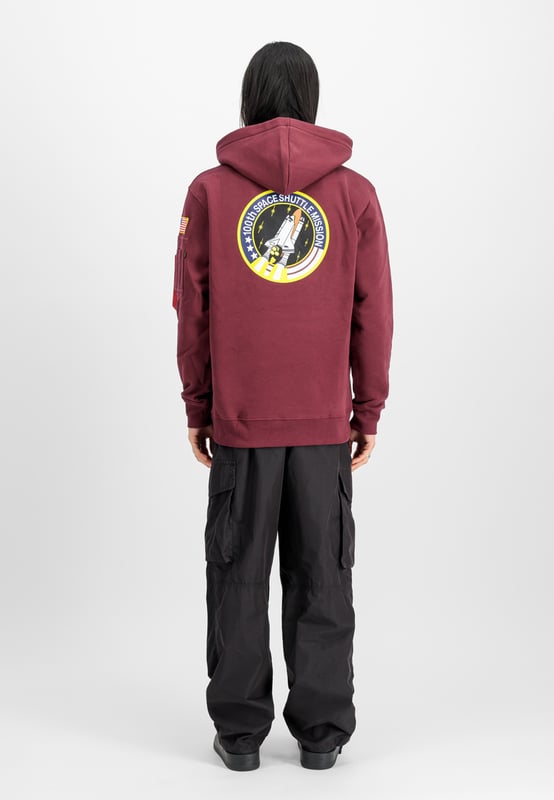 Space Shuttle SMU Hoodie The Space Shuttle Hoodie from ALPHA INDUSTRIES is a stylish hooded sweatshirt for men. Featuring a practical kangaroo pocket, a shell made of 80% cotton and 20% polyester, and a striking logo print pattern, this long-sleeved hoodie is a must-have for all Alpha enthusiasts.