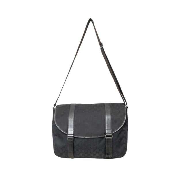 VINTAGE, RRP AS NEW
This black monogram GG canvas bag features a double buckle flap, adjustable crossbody strap, leather straps with dark silver buckles, and a black fabric interior with pockets. 
Remarks: There are minimal signs of wear and a curling on the leather.  Measurments:  width: 1168 mm height: 838 mm