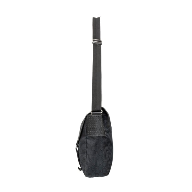 VINTAGE, RRP AS NEW
This black monogram GG canvas bag features a double buckle flap, adjustable crossbody strap, leather straps with dark silver buckles, and a black fabric interior with pockets. 
Remarks: There are minimal signs of wear and a curling on the leather.  Measurments:  width: 1168 mm height: 838 mm