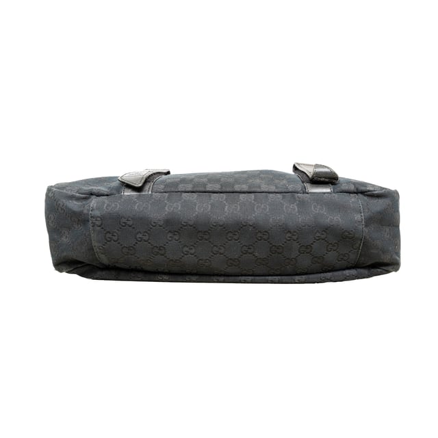 VINTAGE, RRP AS NEW
This black monogram GG canvas bag features a double buckle flap, adjustable crossbody strap, leather straps with dark silver buckles, and a black fabric interior with pockets. 
Remarks: There are minimal signs of wear and a curling on the leather.  Measurments:  width: 1168 mm height: 838 mm