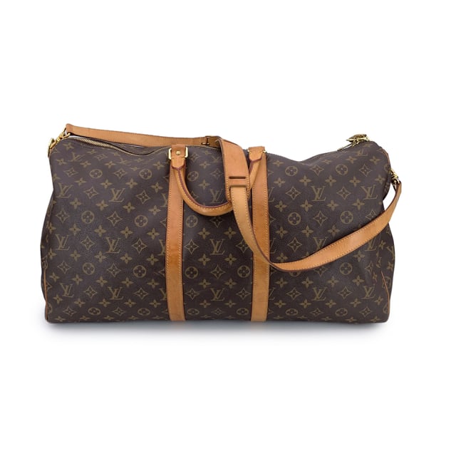 VINTAGE, RRP AS NEW
For the true traveler at heart, the Louis Vuitton Keepall 55 Bandoulière, is more than just a bag-it's a companion built for adventure, designed with timeless elegance and unmistakable heritage. Crafted in Louis Vuitton's signature Monogram canvas and elevated with natural cowhide leather trim, this model strikes the perfect balance between classic luxury and modern edge.  Its generous size makes it ideal for a weekend escape, while thoughtful Condition Rating: B - VERY GOOD CONDITIONCondition Details: Gently used. Some normal wear of use on bottom corners. Some normal wear and light darkness of use on leather trim. Minimal marks on canvas (light brown marks). Padlock is included (but no keys). Please check the photos carefully and ask if you need to know more details or if you have any doubts.Measurements (cm):Depth: 25.4Height: 29.2Length: 55.2Other Details: Dustbag? NoKeys? n.a.Box? No Measurments:  width: 254 mm length: 552 mm height: 292 mm