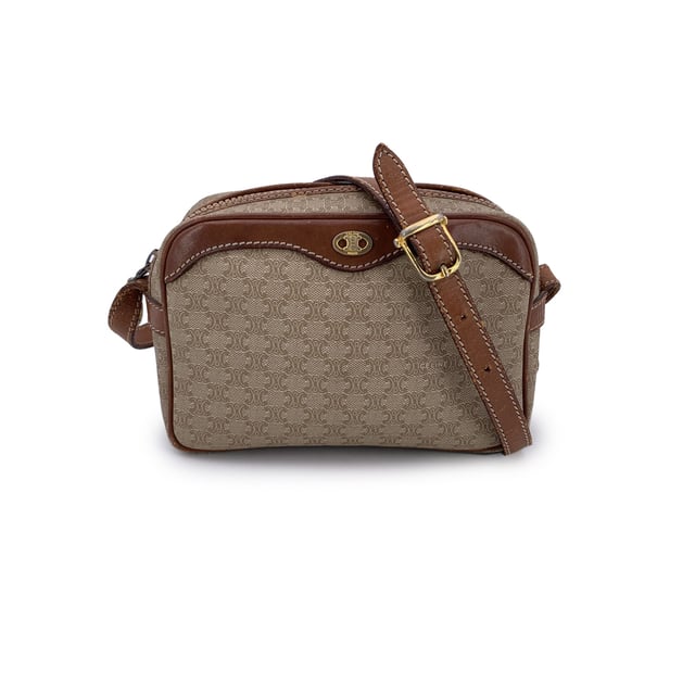 VINTAGE, RRP AS NEW
Embrace classic elegance with this beautiful vintage Celine small Macadam crossbody bag-a timeless piece that captures the charm of 1990s-era luxury. Expertly crafted from Celine's signature beige Macadam vinyl canvas and accented with light brown genuine leather trim, this compact silhouette is both chic and practical.  The bag features gold metal hardware that adds a touch of shine, while the adjustable leather shoulder strap ensures comfortable crossbody wear. An upper zipper closure opens to reveal a clean leather-lined interior, complete with a side zip pocket for your essentials.  Inside, the "Celine Paris" tag and Made in Italy stamp attest to its craftsmanship. Whether you're strolling through the city or dressing up your everyday look, this vintage Celine crossbody brings understated sophistication to every outfit Condition Rating: B - VERY GOOD CONDITIONCondition Details: Gently used. Some wear of use (scratches) leather trim and shoulder strap (especially on bottom corners). Some scratches on the internal lining. Please check the photos carefully and ask if you need to know more details or if you have any doubts.Measurements (cm):Depth: 7.6Height: 12.7Length: 19.1Other Details: Dustbag? NoKeys? NoBox? No Measurments:  width: 76 mm length: 191 mm height: 127 mm