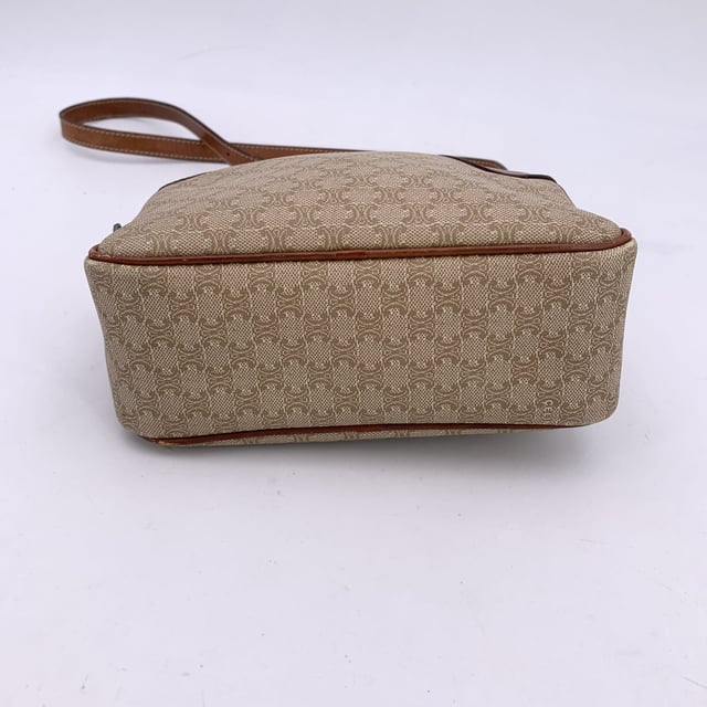 VINTAGE, RRP AS NEW
Embrace classic elegance with this beautiful vintage Celine small Macadam crossbody bag-a timeless piece that captures the charm of 1990s-era luxury. Expertly crafted from Celine's signature beige Macadam vinyl canvas and accented with light brown genuine leather trim, this compact silhouette is both chic and practical.  The bag features gold metal hardware that adds a touch of shine, while the adjustable leather shoulder strap ensures comfortable crossbody wear. An upper zipper closure opens to reveal a clean leather-lined interior, complete with a side zip pocket for your essentials.  Inside, the "Celine Paris" tag and Made in Italy stamp attest to its craftsmanship. Whether you're strolling through the city or dressing up your everyday look, this vintage Celine crossbody brings understated sophistication to every outfit Condition Rating: B - VERY GOOD CONDITIONCondition Details: Gently used. Some wear of use (scratches) leather trim and shoulder strap (especially on bottom corners). Some scratches on the internal lining. Please check the photos carefully and ask if you need to know more details or if you have any doubts.Measurements (cm):Depth: 7.6Height: 12.7Length: 19.1Other Details: Dustbag? NoKeys? NoBox? No Measurments:  width: 76 mm length: 191 mm height: 127 mm