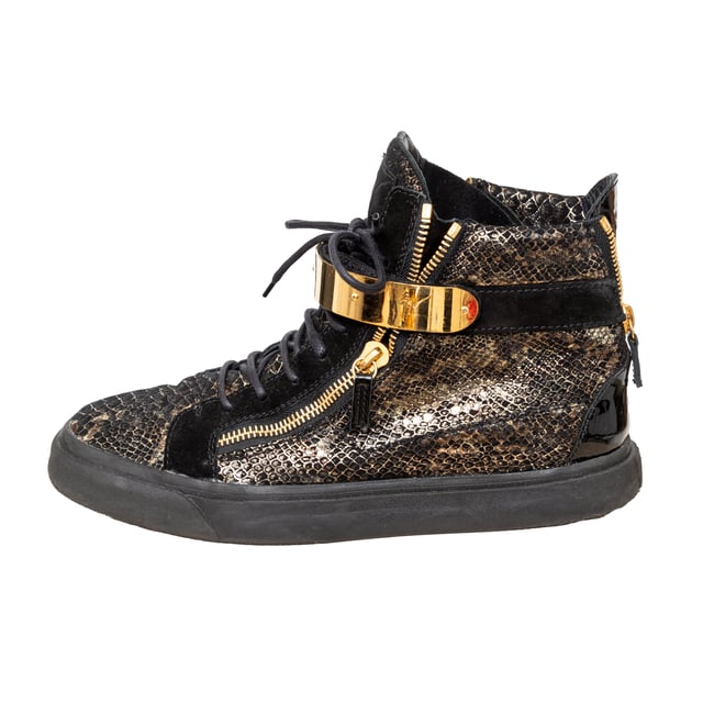 VINTAGE, RRP AS NEW
Elevate your sneaker game with Giuseppe Zanotti's Printed Snakeskin Sneakers. The high-top design features a unique snakeskin print on the signature Coby model, with a velvet and leather construction. Complete with a double gold metal strap and 'Signature' detail for added style. 
Remarks: there are some signs of wear. Measurments:  length: 746 mm