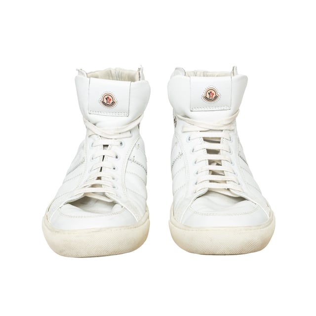 VINTAGE, RRP AS NEW
Elevate your leisure wear with Moncler Lyon High Top Sneakers. Crafted from supple white leather, these sneakers offer luxurious comfort while maintaining a casual look. Featuring discrete branding on the tongue and heel, these high-top trainers are the epitome of elevated sportswear.
Inclusion: dust bag.
Remarks: There are some stain spots inside and some signs of wear.  Measurments:  length: 746 mm