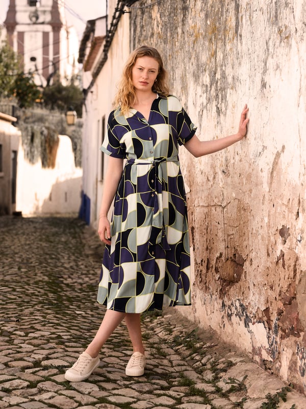 This versatile midi shirt dress features a collared V-neckline and grown-on sleeves with turnback cuffs, along with an easy-to-wear self-tie belt for adjustable styling. A wardrobe staple with a relaxed fit for every occasion.