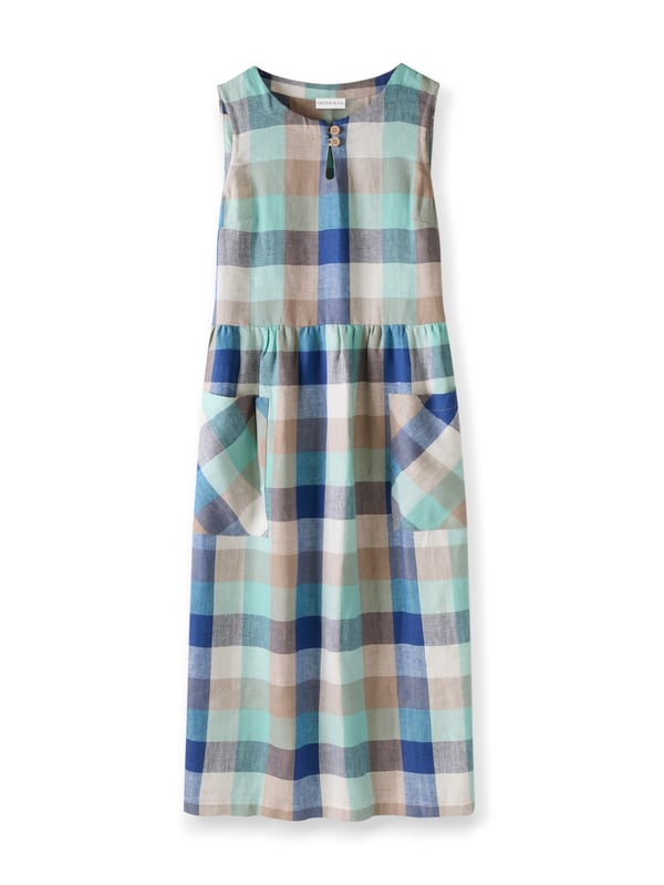 This sleeveless midi dress is made from a mid-weight, woven fabric. The large scale gingham print is bright and summery. The skirt is gathered at the waist seam to provide a full, drapey appearance, and has large patch pockets that are cut on the bias, adding nice detail. The crew neckline features a keyhole detail with two coconut buttons and loop fastenings.