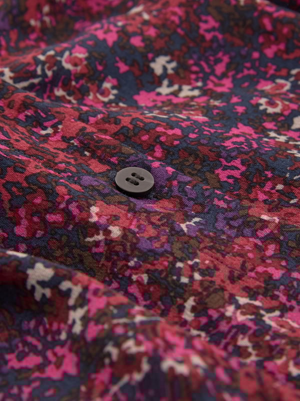 This midi shirt dress embodies our signature aesthetic, featuring a collared neckline and a flattering self-tie detail. With convenient side pockets, it offers a button-through closure crafted from a viscose blend, giving a flattering drape.Made in Romania.