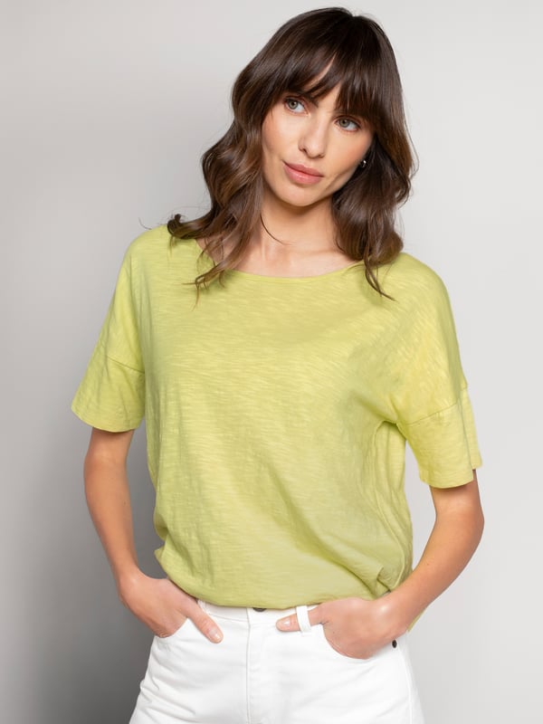 Designed with a round neckline and relaxed drop shoulders, this boxy-fit tee offers effortless drape and movement. The slub jersey fabric provides a soft texture, perfect for an easy, versatile style.