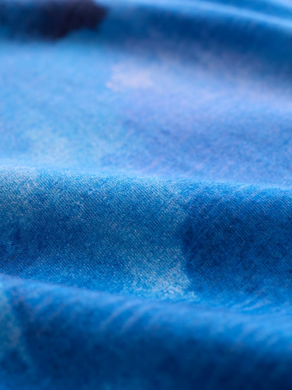 A casual staple with a boat neckline and fold-over collar, this tee’s straight fit and grown-on sleeves make it perfect for relaxed dressing. The slub texture adds visual depth for a versatile, laid-back style.
