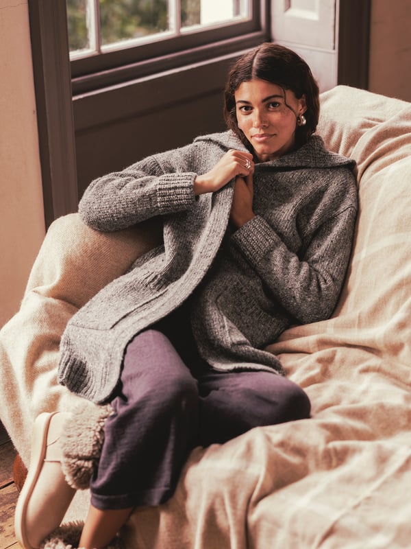 The Donegal longline coatigan is the perfect mix between a coat and a cardigan, thanks to the chunkier weight Donegal yarn that it is knitted from. With its statement shawl collar, edge to edge styling and longer length you can wear it both outside and in, depending on what the Great British weather throws your way. Details include patch pockets and a ribbed collar and cuffs.