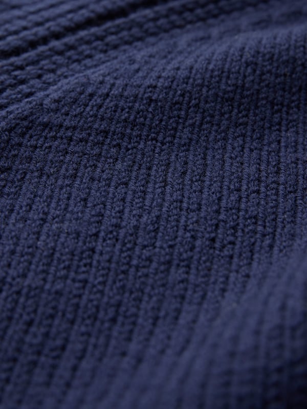 Boasting a rolled neckline and raglan sleeves, this jumper features a slouchy fit, with contrast rib detail adding texture and interest. Made in a chunky knit for a luxury feel.