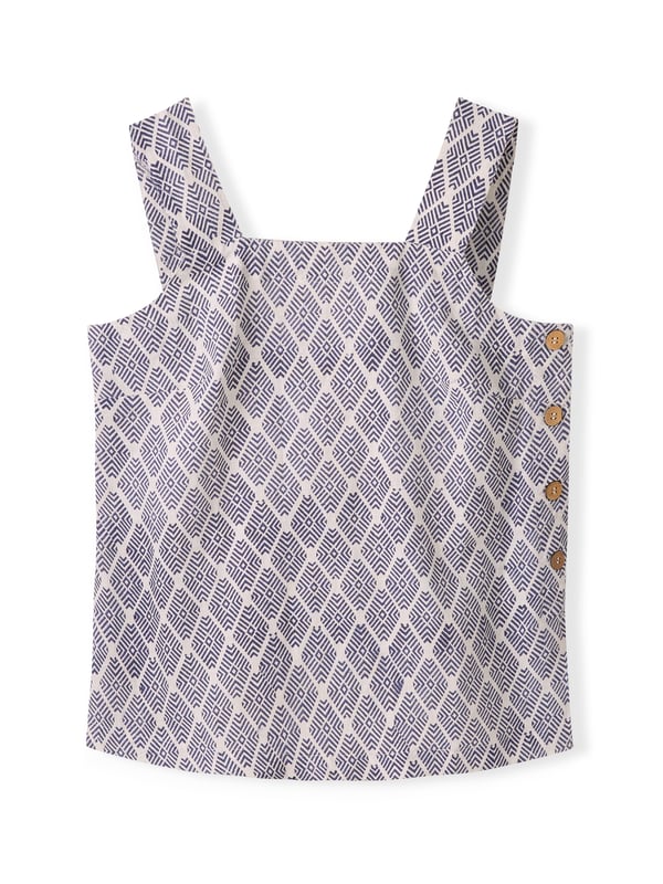 Featuring a square neckline and buttoned side placket detail, this top offers a straight and easy fit. Its simple yet refined design makes it an essential piece for layering or wearing alone. The printed version of this style is achieved by the artisanal technique of wood-block printing. Using a hand carved wood block, the design is repeatedly stamped on the fabric by artisans to achieve a unique, individual garment.