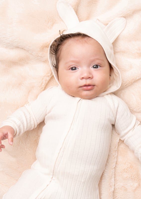 Introduce your little ones to the whimsical world of rabbits with this charming neutral rib baby grow. featuring a rabbit ear design and even a tail for extra cuteness! Crafted with care and comfort in mind. it's the perfect combination of style and comfo.