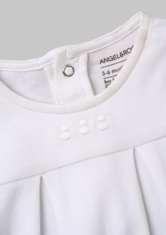 Marcel White Organic cotton collar babygrow Hello little one! This super soft sleepsuit is designed to keep baby warm and cosy. The adorable style is adorned with cute collar and pleat detail. and has been thoughtfully designed with enclosed feet. fold over mitts and no scratchy neck label. making.