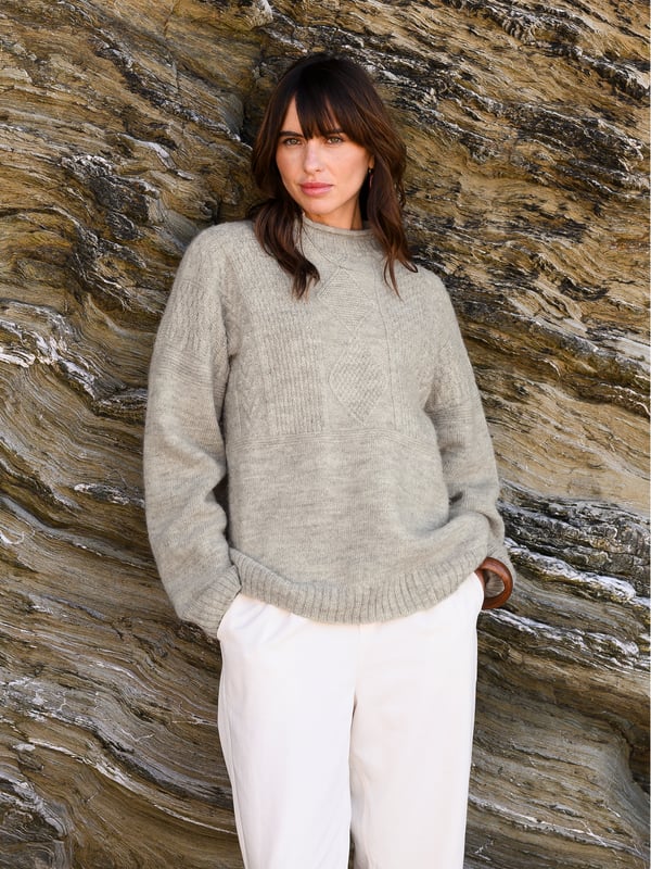 We're proud to say that from farm to factory our beautiful Gansey jumper is produced entirely in Britain. A take on the traditional fisherman’s Gansey jumper, we’ve been inspired by stitch patterns used historically in Cornish fishing villages. Details include a boxy, drop shoulder body shape with T sleeves and a ribbed and cast off rolled collar. Panelled stitch patterns run across the top half of the jumper, plus it is ‘knitted in the round’, meaning it is seamless, just as the traditional fisherman’s jumpers were made. Made using undyed wool, the natural fibres keep you warm in cold weather, but are breathable too.