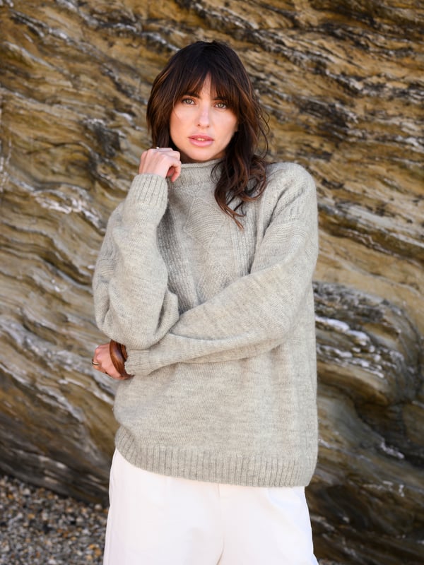 We're proud to say that from farm to factory our beautiful Gansey jumper is produced entirely in Britain. A take on the traditional fisherman’s Gansey jumper, we’ve been inspired by stitch patterns used historically in Cornish fishing villages. Details include a boxy, drop shoulder body shape with T sleeves and a ribbed and cast off rolled collar. Panelled stitch patterns run across the top half of the jumper, plus it is ‘knitted in the round’, meaning it is seamless, just as the traditional fisherman’s jumpers were made. Made using undyed wool, the natural fibres keep you warm in cold weather, but are breathable too.