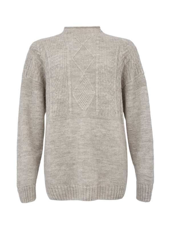 We're proud to say that from farm to factory our beautiful Gansey jumper is produced entirely in Britain. A take on the traditional fisherman’s Gansey jumper, we’ve been inspired by stitch patterns used historically in Cornish fishing villages. Details include a boxy, drop shoulder body shape with T sleeves and a ribbed and cast off rolled collar. Panelled stitch patterns run across the top half of the jumper, plus it is ‘knitted in the round’, meaning it is seamless, just as the traditional fisherman’s jumpers were made. Made using undyed wool, the natural fibres keep you warm in cold weather, but are breathable too.