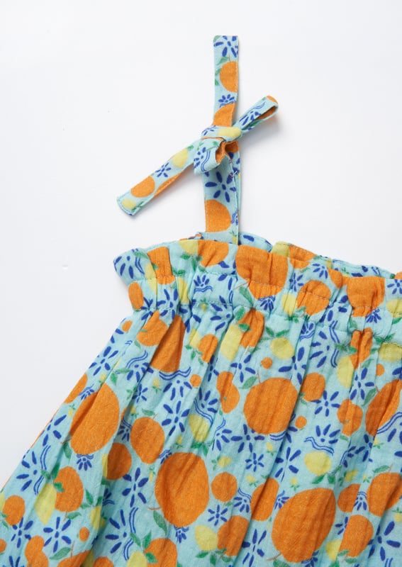 This scrumptious fruit print romper is crafted from soft double cloth cotton. providing both comfort and style. Soft. breathable. and perfect for summer days. it’s the ideal piece for little ones—and pairs perfectly with our big sister dress!.