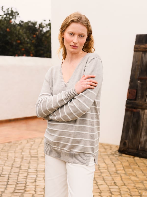 Our Merino V Neck Jumper has been seamlessly knitted in Britain with full-length sleeves and a ribbed hem and cuffs. The clean, luxury handle of the merino wool offers warmth to a traditional v-neck style in a contemporary breton stripe design. Whether you're layering up for the evening or keeping it casual, this jumper is a versatile choice for any occasion.