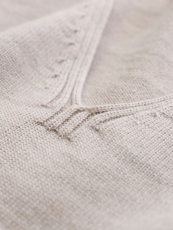 Our Merino V Neck Jumper has been seamlessly knitted in Britain with full-length sleeves and a ribbed hem and cuffs. The clean, luxury handle of the merino wool offers warmth to a traditional v-neck style in a contemporary breton stripe design. Whether you're layering up for the evening or keeping it casual, this jumper is a versatile choice for any occasion.