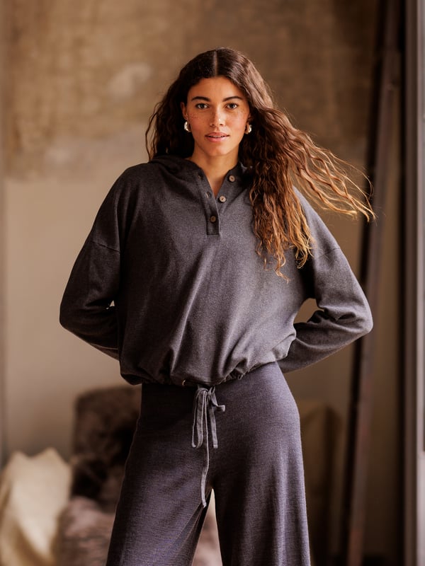 Pull up the cosy, double layered hood and snuggle down in comfort. Part of our lounge collection, this hooded jumper with long, warm sleeves is easy to style when both lounging at home or heading out. Designed to coordinate with the rest of the lounge collection range, details include a short button through placket on the front and drawstring hem detail with a tonal drawcord.