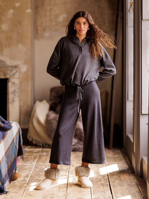 Pull up the cosy, double layered hood and snuggle down in comfort. Part of our lounge collection, this hooded jumper with long, warm sleeves is easy to style when both lounging at home or heading out. Designed to coordinate with the rest of the lounge collection range, details include a short button through placket on the front and drawstring hem detail with a tonal drawcord.