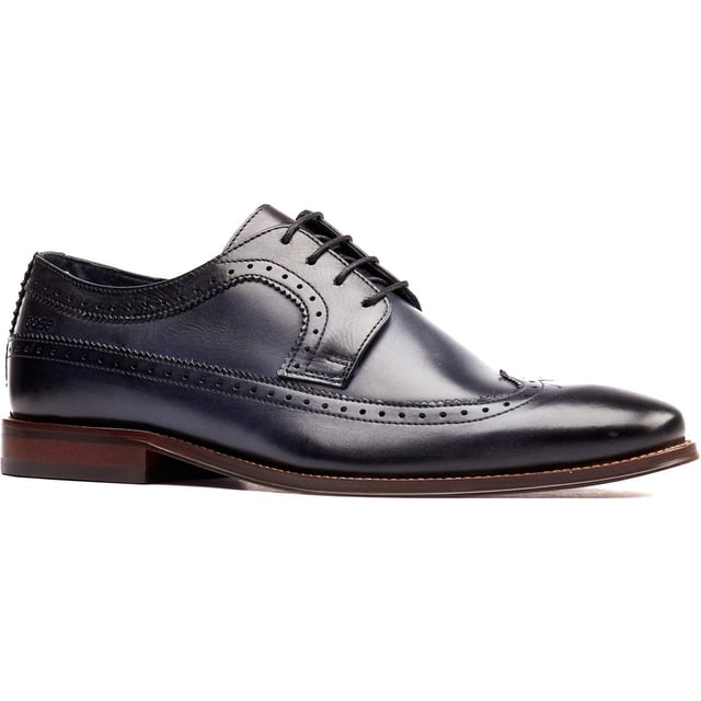 Base London Havisham Leather Men's Navy Derby Shoes Crafted from smooth leather uppers, the Havisham formal men's shoe features beautiful brogue detailing and a wing tip that runs all the way to the heel where a Base brand can be found embossed into the leather.