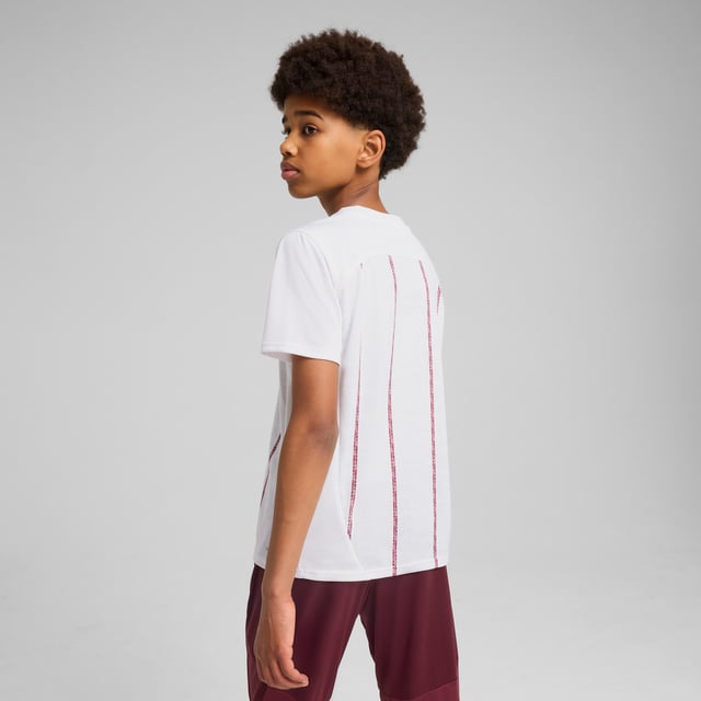 PUMA Kids Unisex Manchester City Pre-match Jersey PRODUCT STORY: Show your love for Manchester's best club with this PUMA jersey. Featuring iconic team branding, high-performance details, and sleek PUMA details, it's perfect for cheering at the Etihad Stadium or repping your team wherever you go. Feel the energy, wear the pride. FEATURES & BENEFITS: dryCELL: Performance technology designed to wick moisture from the body and keep you free of sweat during exercise; Made with 100% recycled material excluding trims & decorations. DETAILS: Regular fit; Single jersey material; Regular length; Crew neck; Short sleeves; Medium rise; Printed graphic; Manchester City badge and PUMA Cat logo; PUMA Youth: Recommended for older kids between 8 and 16 years.