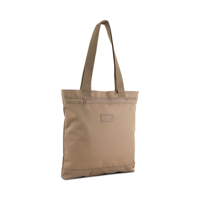 PRODUCT STORY: Elevate your everyday essentials with this versatile tote. Featuring a padded laptop sleeve, front zip pocket, and webbing carry handles, it combines practicality and style. The PUMA Cat Logo adds a bold touch to your daily adventures. FEATURES & BENEFITS: Made with at least 50% recycled materials. DETAILS: Zipped main compartment; Front zip pocket; Internal padded laptop sleeve; Webbing carry handles; PUMA branding details.