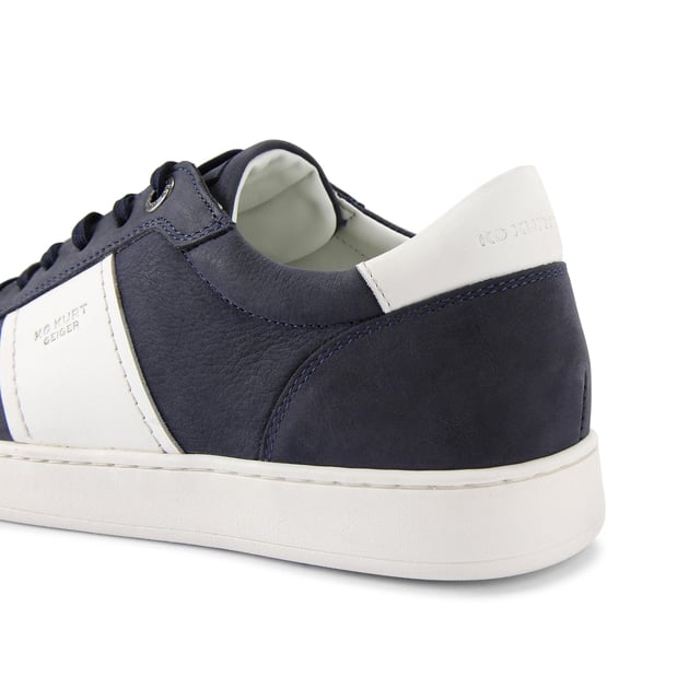 KG Kurt Geiger Spark Sneakers This KG Kurt Geiger pair of Spark sneakers arrive in a navy Nubuck leather with two white stripes either side. The front laces up and there is embossed branding on the heel.