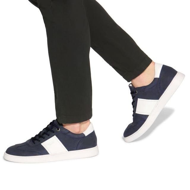 KG Kurt Geiger Spark Sneakers This KG Kurt Geiger pair of Spark sneakers arrive in a navy Nubuck leather with two white stripes either side. The front laces up and there is embossed branding on the heel.