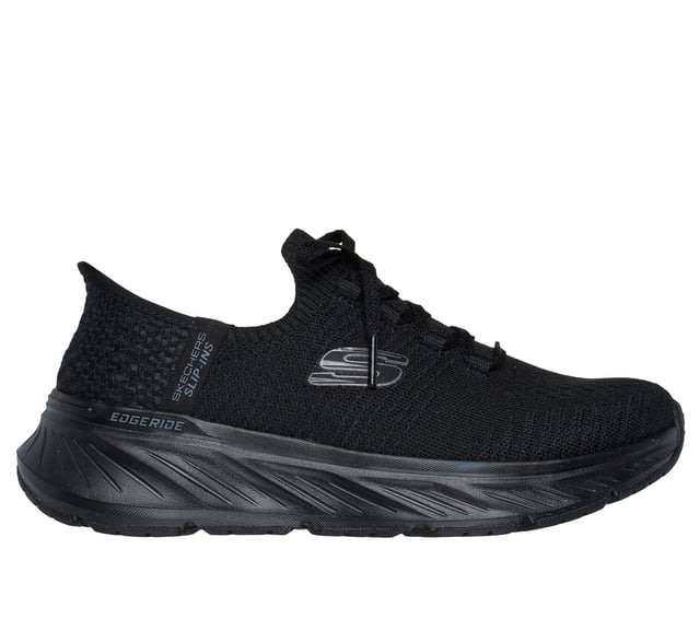 Skechers Edgeridge Dames Zwarte Sneakers Skechers Hands Free Slip-ins®. Deze milieuvriendelijke, veganistische sportsneaker is gemaakt van gerecyclede materialen en heeft een ademend stretchgebreid bovenwerk met vaste stretchveters voor gemakkelijk aantrekken. Ontworpen voor de hele dag ondersteuning, het bevat een goed gedempte tussenzool en een Skechers Air-Cooled Memory Foam® inlegzool voor superieur comfort en luchtcirculatie. Perfect voor wandelen, reizen en dagelijks gebruik.