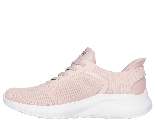 Step into effortless style with Skechers Hands Free Slip-ins®. This fashionable slip-on sneaker features an engineered knit upper with stretch laces for a secure, sock-like fit. Designed with Skechers’ exclusive Heel Pillow™ for added heel support and stability, it also includes a cushioned Skechers Memory Foam™ insole for long-lasting comfort. Perfect for everyday wear, walking, or travel, this easy-on style blends modern design wth all day support.