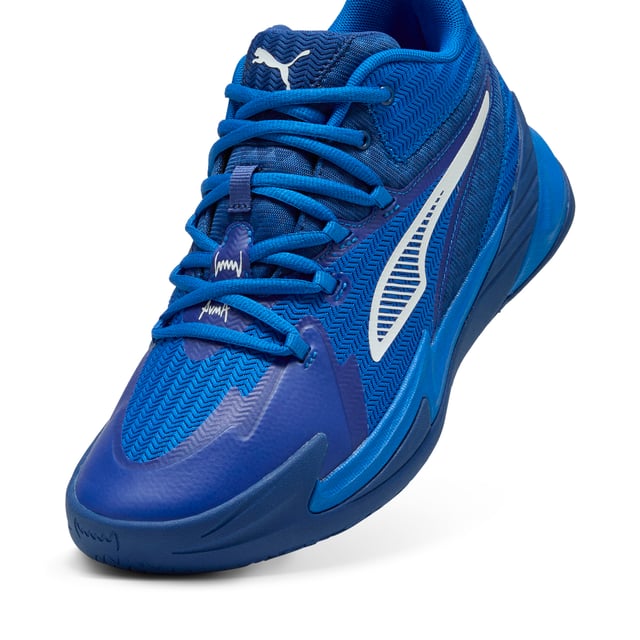 PRODUCT STORY: Stand out with fast, progressive design. Our latest innovation features a PROFOAM midsole for lightweight rebound, PUMA BITE outsole for traction, and dynamic lacing for a secure fit. Perfect for dominating outdoor courts with confidence and style. Get ready to win. FEATURES & BENEFITS: The upper of the shoes is made with at least 20% recycled materials; PUMA BITE: Durable outsole pattern that offers superior traction on the court; PROFOAM: Lightweight EVA designed to cushion your landing and propel your next step. DETAILS: Regular width; Dynamic lacing system with anchor points on the vamp and through the forefoot, for a more secure, sure-footed feel; External rubber wrap-up for lateral stability; PUMA Hoops Jaws branding; PUMA branding details.