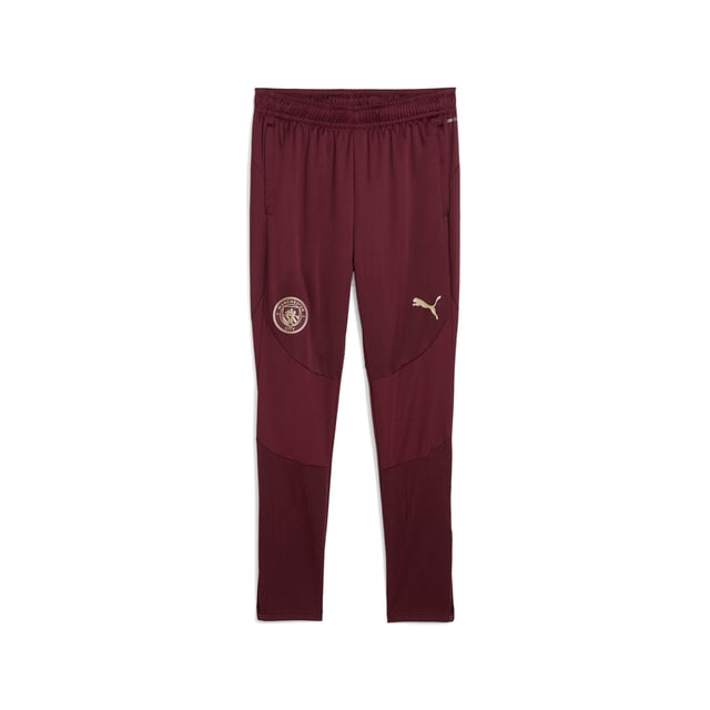 PUMA Mens Manchester City Training Pants PRODUCT STORY: Cityzens, show your pride with these PUMA training pants. Featuring an elasticated waistband, flat drawcords, zip leg openings, and zip pockets, they're perfect for any Manchester fan. The iconic badge and Cat Logo on the legs, along with jacquard fabric graphics, bring the spirit of Etihad Stadium to life. FEATURES & BENEFITS: dryCELL: Performance technology designed to wick moisture from the body and keep you free of sweat during exercise; Made with 100% recycled material excluding trims & decorations. DETAILS: Slim fit; Main material: Pique; Below knee length; Medium rise; Elasticated waistband with flat drawcords; Zip leg opening; Zip pockets; PUMA Cat logo placed on the left leg; Manchester City crest placed on the right leg.