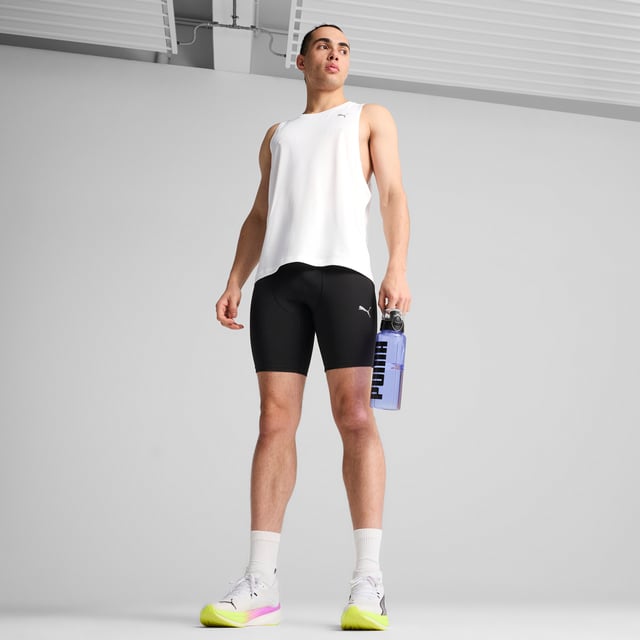 PRODUCT STORY: Unleash your run with these 8" short tights. Featuring ergonomic cutlines for ultimate freedom, dryCELL technology to keep you dry, and a tunneled drawcord for a perfect fit. Drop-in phone pockets ensure your essentials stay secure. Run free, run strong. FEATURES & BENEFITS: Made with at least 50% recycled materials; dryCELL: Performance technology designed to wick moisture from the body and keep you free of sweat during exercise. DETAILS: Tight fit; Interlock fabric; Above knee length; Medium rise; PUMA branding details.
