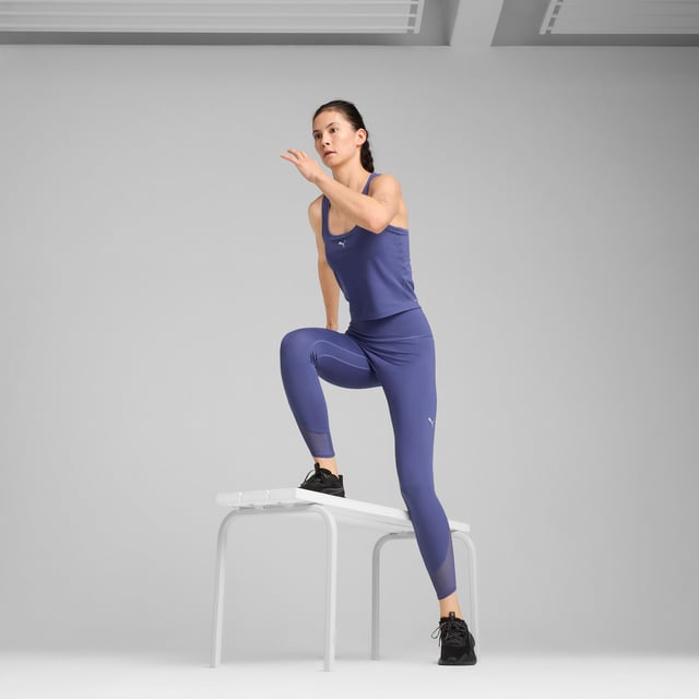 PRODUCT STORY: Conquer your workout with ultra-soft 7/8 length tights, featuring CLOUDSPUN fabric for unmatched softness and dryCELL for moisture control. Mesh inserts add flair, while a hidden waistband pocket keeps your valuables safe. Sculpting design lines ensure a flattering fit. FEATURES & BENEFITS: Made with at least 50% recycled materials; dryCELL: Performance technology designed to wick moisture from the body and keep you free of sweat during exercise; CLOUDSPUN: Custom-milled performance poly/spandex blend, this fabric meets the highest performance standards while still feeling like an ultra soft cotton. DETAILS: Tight fit; Interlock fabric; 7/8 length; High rise; PUMA branding details.