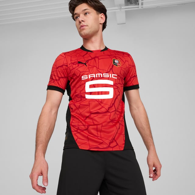 PRODUCT STORY: Gear up and show your allegiance to Stade Rennais with the official 24/25 Home Jersey. It's design symbolizes the beating heart of the city of Rennes and the matchday ritual walk along the "La Vilaine" river that leads fans to the stadium. It features moisture-wicking dryCELL tech to keep you feeling cool and comfortable. FEATURES & BENEFITS: dryCELL: Performance technology designed to wick moisture from the body and keep you free of sweat during exercise; As part of the RE:FIBRE program, this garment is made of at least 95% recycled material from textile waste and other used materials. DETAILS: Regular fit; 170 gsm, Jacquard; Crew neck; Short sleeves; Official team branding.
