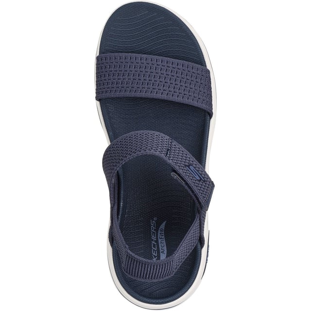 Enjoy supportive casual comfort on warm sunny days with the Skechers GO WALK Arch Fit 2.0 sandal. This knit quarter strap sandal features a textile upper with lightweight ULTRA GO cushioning and an Arch Fit footbed