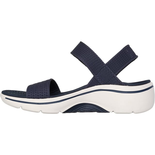 Enjoy supportive casual comfort on warm sunny days with the Skechers GO WALK Arch Fit 2.0 sandal. This knit quarter strap sandal features a textile upper with lightweight ULTRA GO cushioning and an Arch Fit footbed