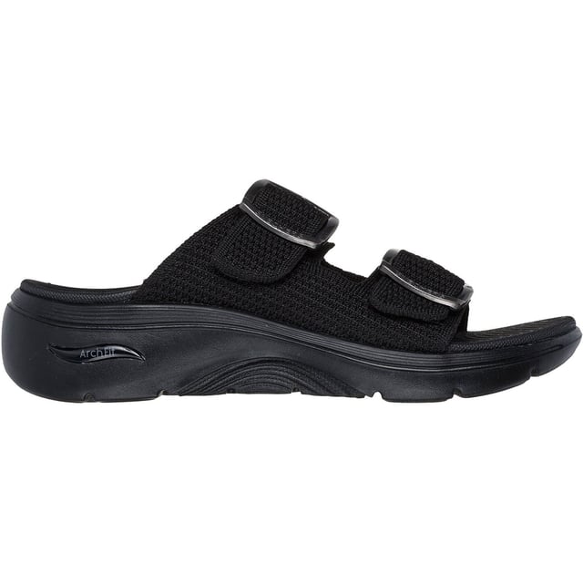 Geniet van ondersteunend casual comfort op warme, zonnige dagen met de Skechers GO WALK Arch Fit 2.0 sandaal. Deze sandaal met dubbele band en gesp heeft een Quick-Dry textiel bovenwerk met lichtgewicht ULTRA GO demping en een Arch Fit voetbed.