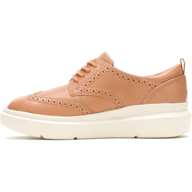 Hush Puppies Joy Leather Women's Tan Brogues Shoes Classic styling meets modern tech with the Joy Wingtip Lace, an ergonomic design with The Body Shoe Flex for natural movement, our super springy Mega Bounce outsole and Bounce footbed for comfort, and made with recycled materials