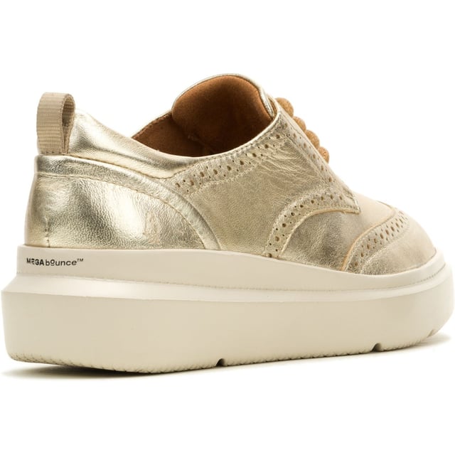 Hush Puppies Joy Leather Women's Champagne Brogues Shoes Classic styling meets modern tech with the Joy Wingtip Lace, an ergonomic design with The Body Shoe Flex for natural movement, our super springy Mega Bounce outsole and Bounce footbed for comfort, and made with recycled materials