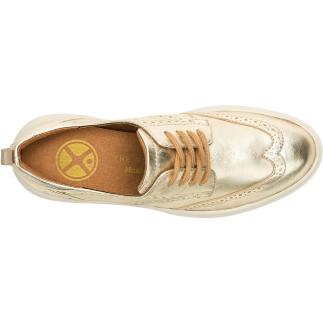 Hush Puppies Joy Leather Women's Champagne Brogues Shoes Classic styling meets modern tech with the Joy Wingtip Lace, an ergonomic design with The Body Shoe Flex for natural movement, our super springy Mega Bounce outsole and Bounce footbed for comfort, and made with recycled materials