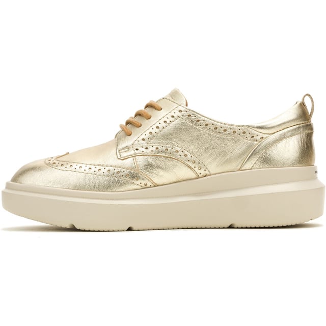 Hush Puppies Joy Leather Women's Champagne Brogues Shoes Classic styling meets modern tech with the Joy Wingtip Lace, an ergonomic design with The Body Shoe Flex for natural movement, our super springy Mega Bounce outsole and Bounce footbed for comfort, and made with recycled materials